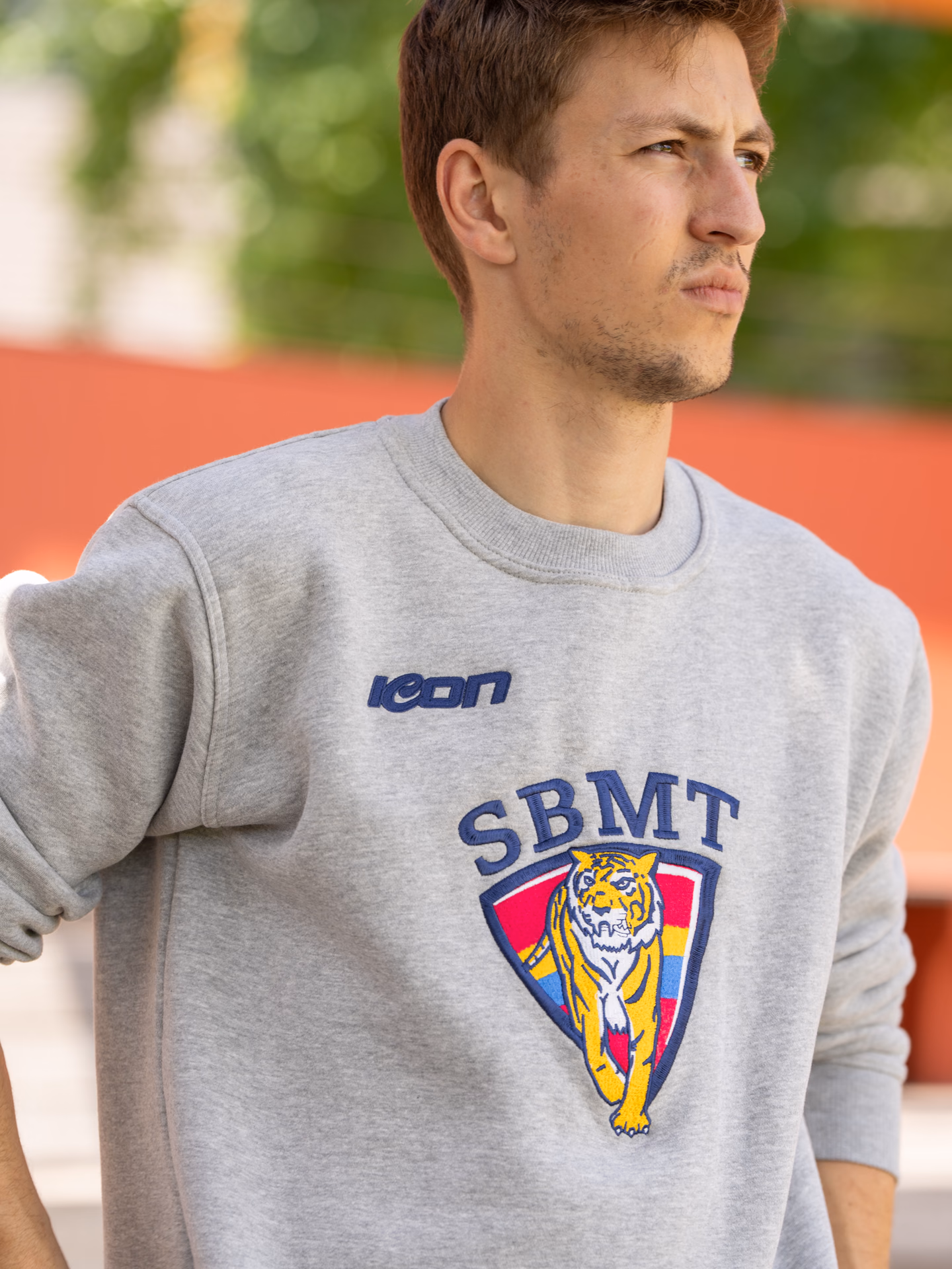 Model wearing a grey Icon Sports club sweatshirt
