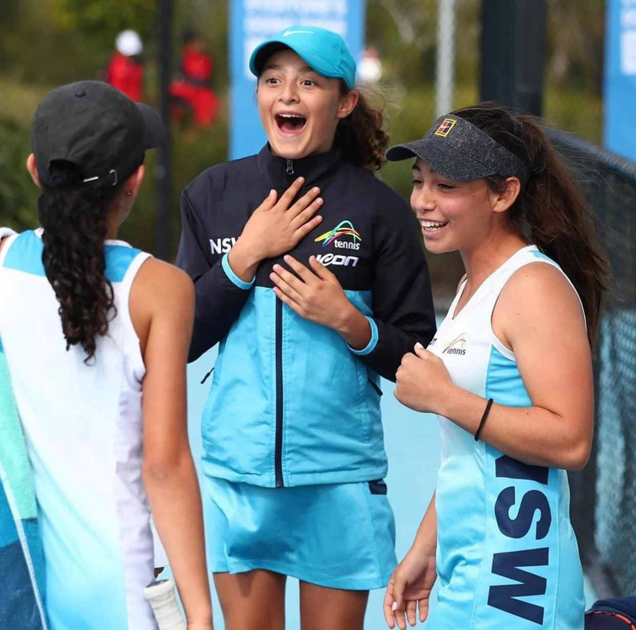 Netball teammates together in blue and navy Icon Sports kit