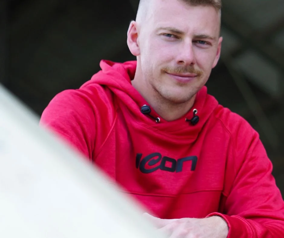 Red Icon Sports hoodie worn outdoors